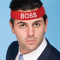 funny image of man in suit wearing a red custom sweatband that says boss